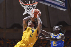 WVU beats Pitt 74-59, Bob Huggins ties Knight with 902 wins